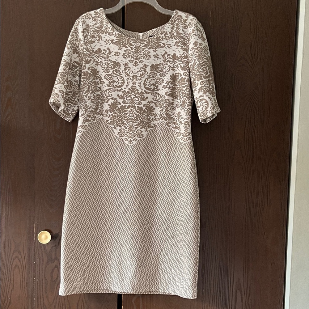 Connected short sleeved cream and tan midi dress. Size 12.